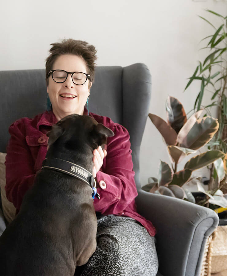 Melody Edwardson, counsellor Brisbane, in her office with her dog, Rocky.